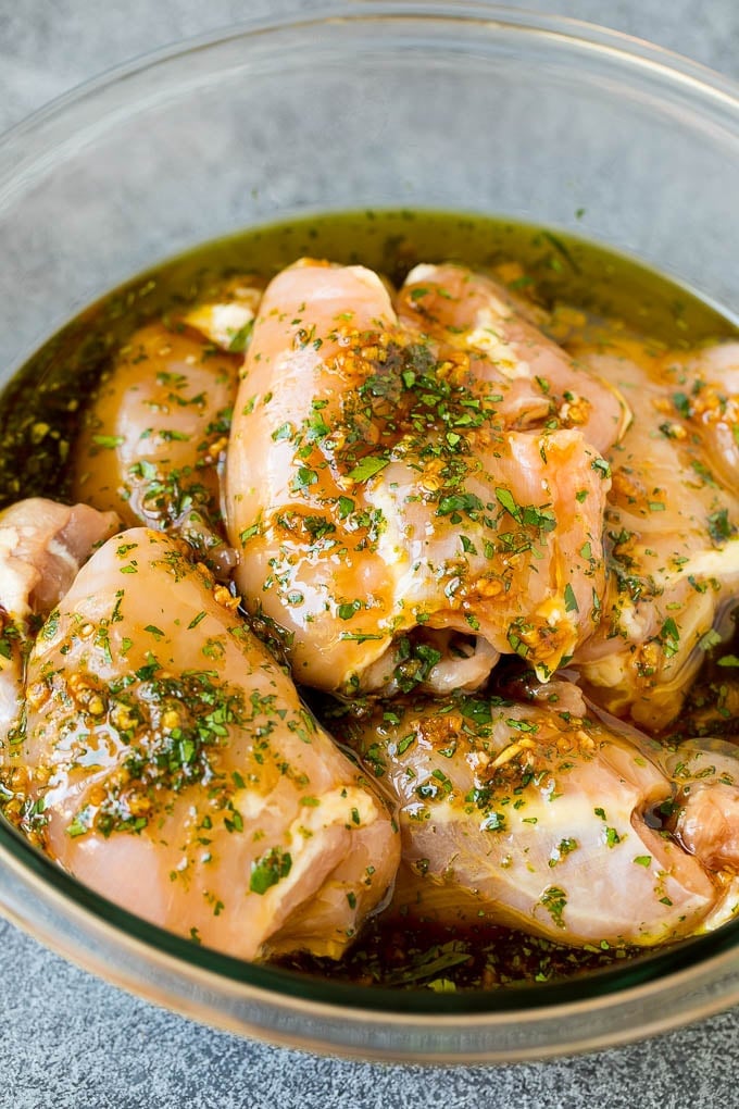 Grilled Chicken Thighs Recipe | Marinated Chicken Thighs #chicken #grilling #marinade #dinner #cilantro #lime #fuyos Poultry in a bowl of marinade.