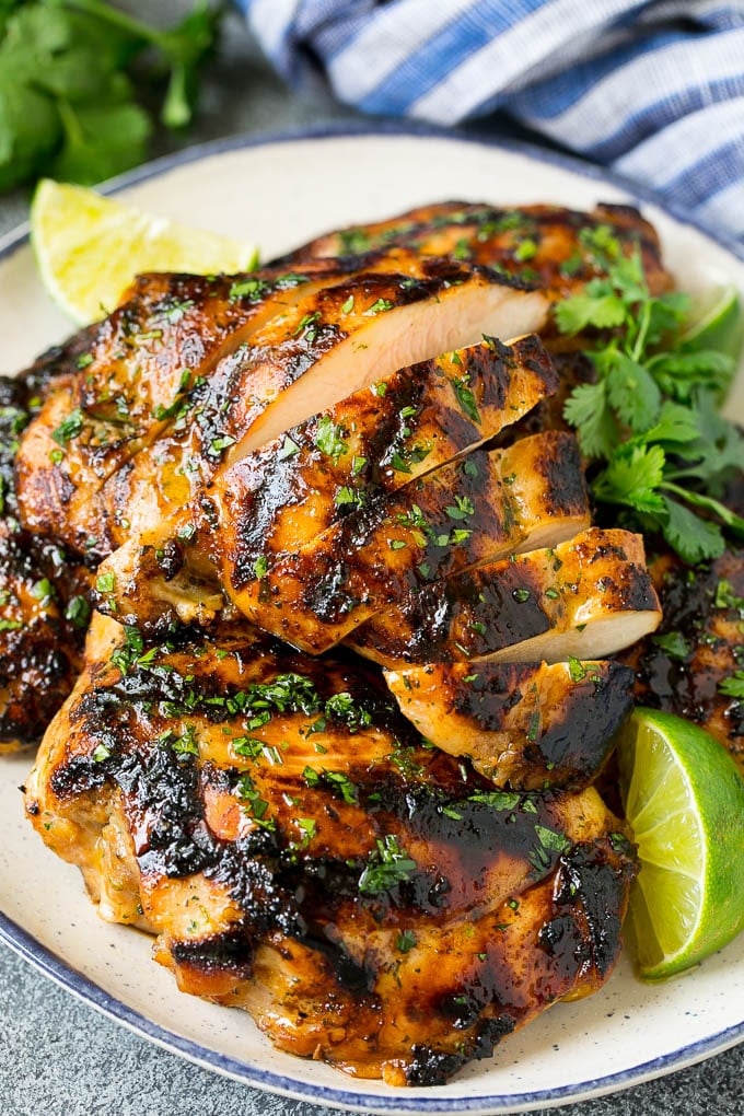 Grilled Chicken Thighs Recipe | Marinated Chicken Thighs #chicken #grilling #marinade #dinner #cilantro #lime #fuyos Sliced grilled chicken thighs with cilantro and lime flavoring.