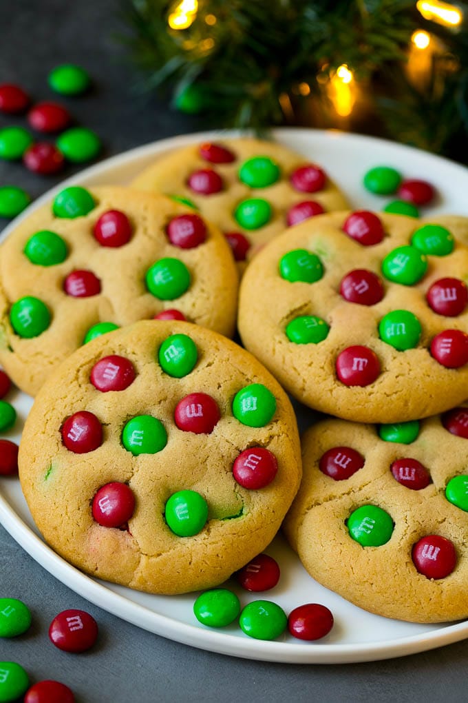 M&M Cookies Recipe #cookies #chocolate #baking #dessert #sweets #fuyos A plate of Christmas cookies with red and green M&Ms in them.