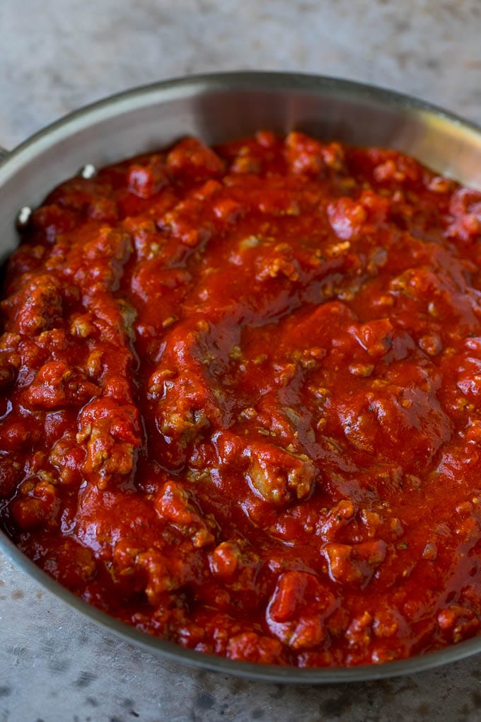 Baked Spaghetti Recipe | Baked Pasta #spaghetti #pasta #cheese #casserole #beef #sausage #dinner #fuyos Meat sauce in a skillet.