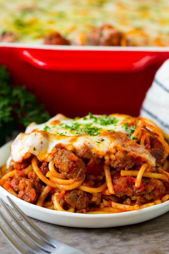 Baked Spaghetti Recipe | Baked Pasta #spaghetti #pasta #cheese #casserole #beef #sausage #dinner #fuyos A serving of baked spaghetti topped with melted cheese.