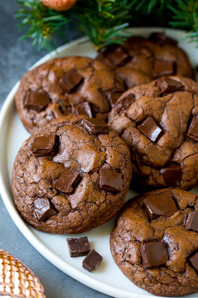 Brownie Cookies Recipe | Chocolate Cookies #cookies #brownies #chocolate #dessert #baking #fuyos Brownie cookies on a serving plate, topped with chocolate chunks.