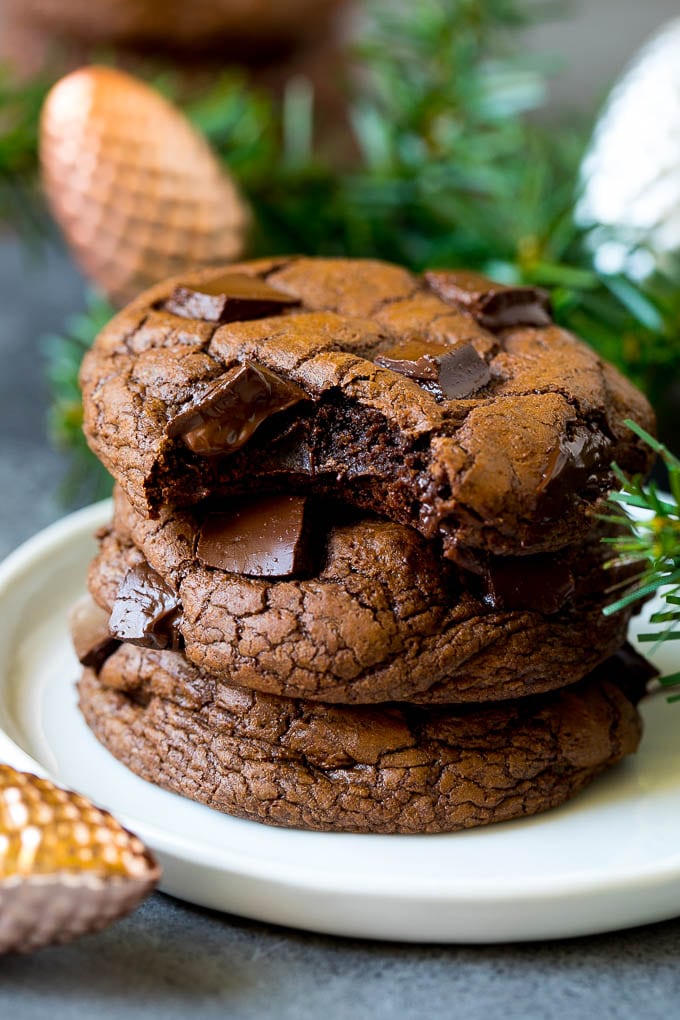 Brownie Cookies Recipe | Chocolate Cookies #cookies #brownies #chocolate #dessert #baking #fuyos A stack of brownie cookies with a bite taken out of one.