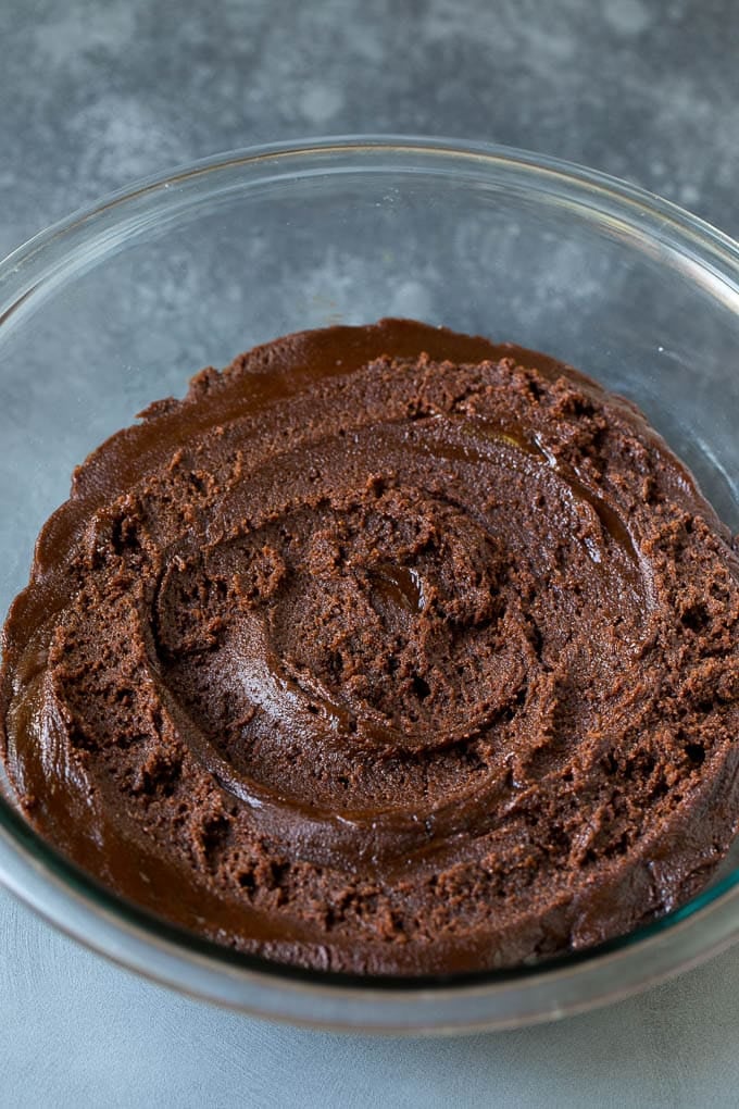 Chocolate Crinkle Cookies Recipe #cookies #chocolate #christmas #dessert #baking #fuyos A bowl of chocolate cookie dough.