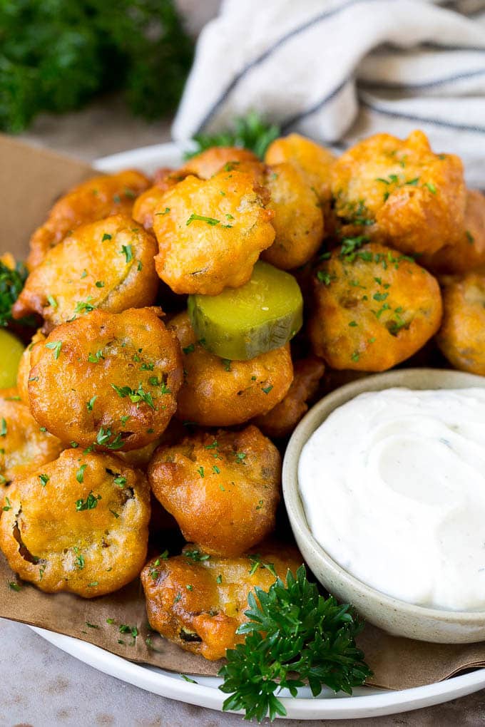 Fried Pickles Recipe #pickles #appetizer #snack #fuyos A plate of fried pickles, served with ranch dip.