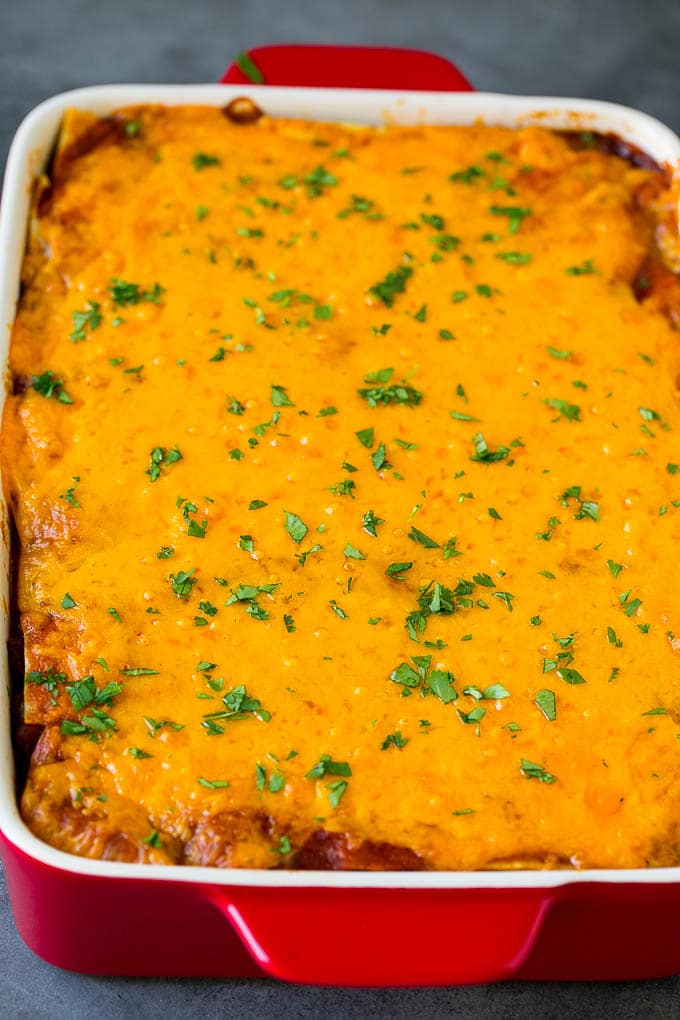 Mexican Lasagna Recipe | Mexican Casserole #mexican #lasagna #groundbeef #beans #dinner #cheese #fuyos A baked Mexican casserole topped with melted cheese and cilantro.