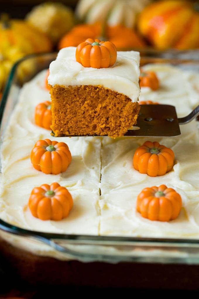 A spatula serving up a slice of pumpkin cake.