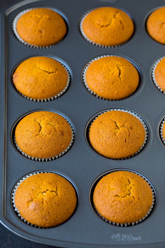 Baked cupcakes in a muffin tin.