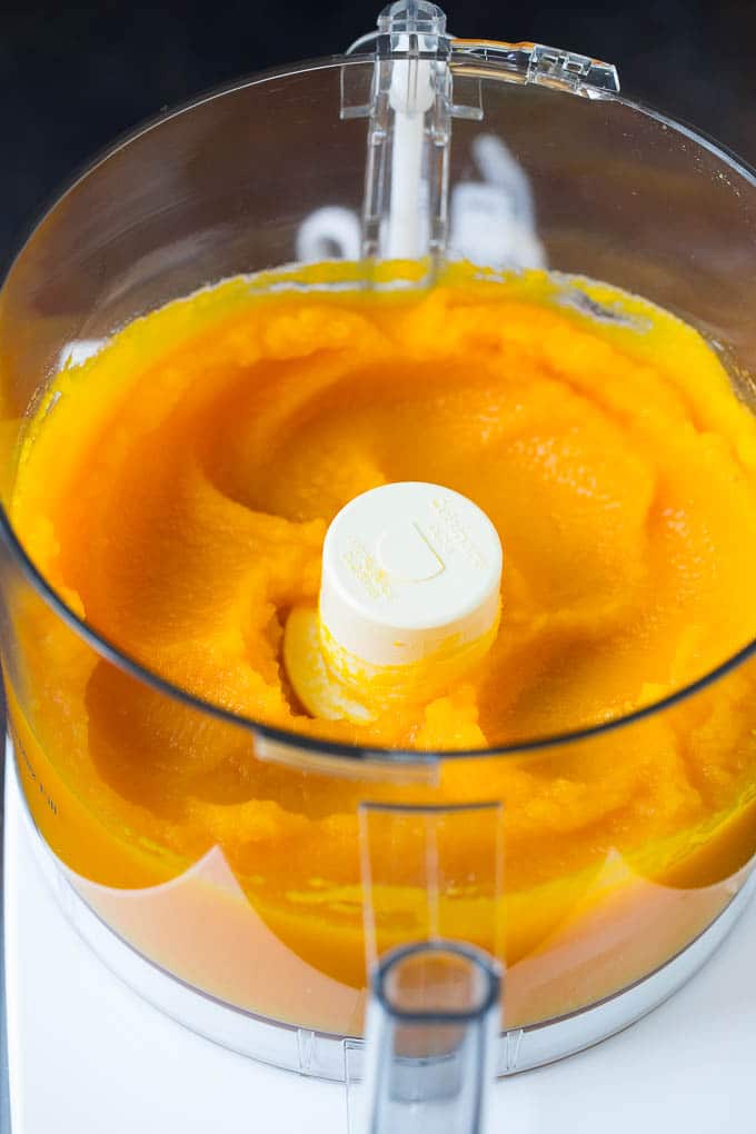 Pumpkin Puree Recipe #pumpkin #baking #fall #thanksgiving #fuyos Pureed pumpkin in a food processor.