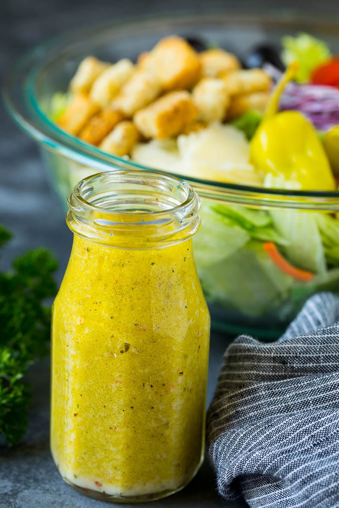 Olive Garden Salad Recipe | Italian Salad #salad #lettuce #olives #sidedish #dinner #fuyos A bottle of homemade salad dressing.