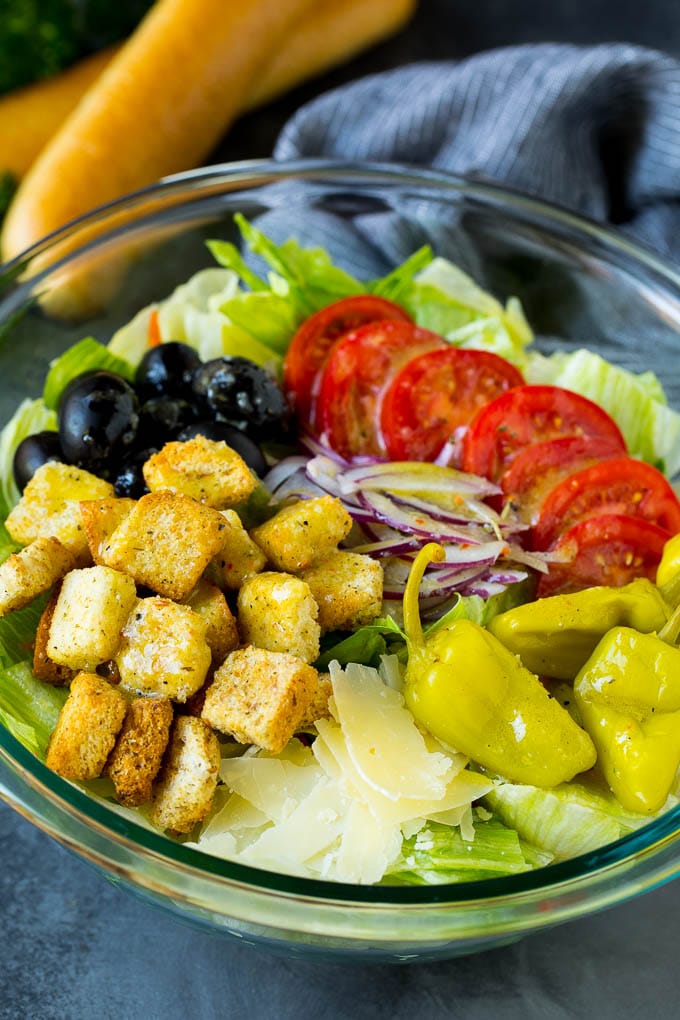 Olive Garden Salad Recipe | Italian Salad #salad #lettuce #olives #sidedish #dinner #fuyos Olive Garden salad with tomatoes, croutons, cheese and olives.
