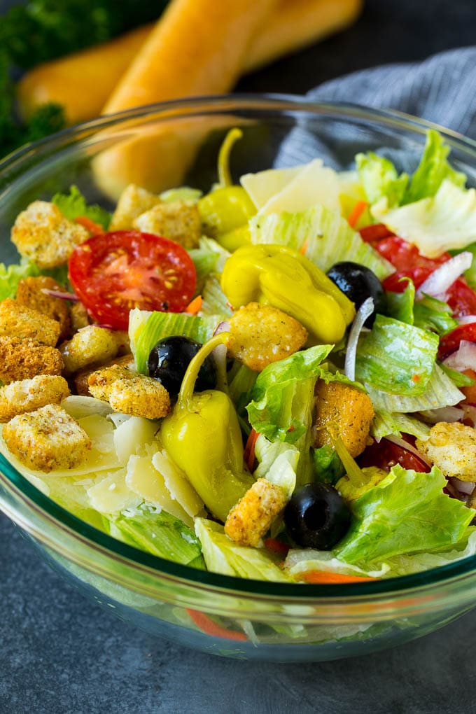 Olive Garden Salad Recipe | Italian Salad #salad #lettuce #olives #sidedish #dinner #fuyos A tossed Olive Garden salad with Italian dressing, vegetables and olives.