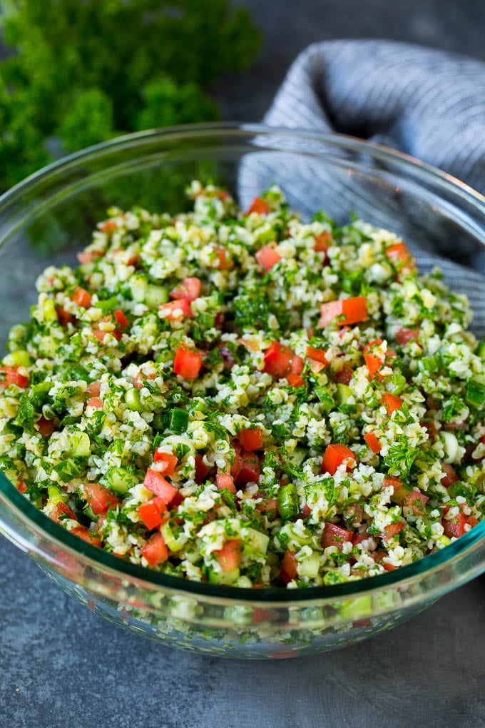 Tabbouleh Salad | Tabouli #salad #wheat #tomatoes #cucumber #healthy #sidedish #dinner #fuyos A serving bowl filled with tabbouleh salad.