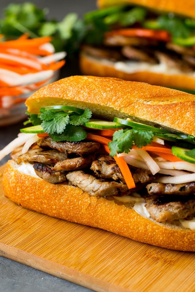 A banh mi sandwich layered with pork, pickled vegetables and herbs.
