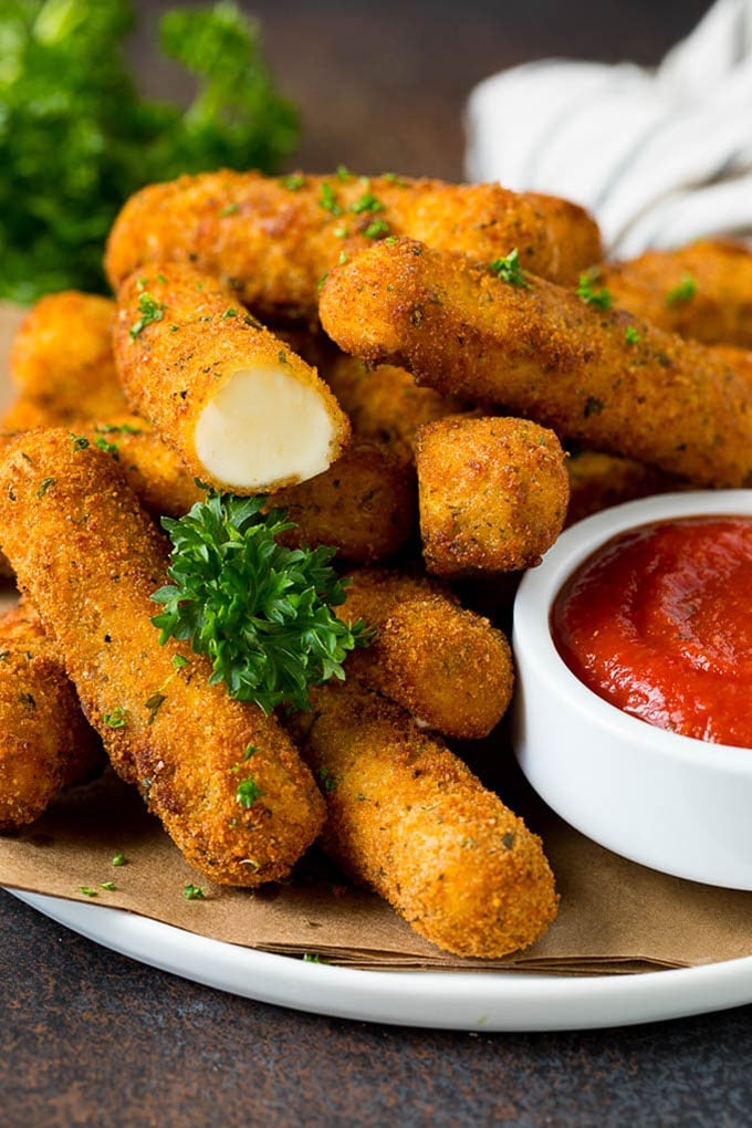 Mozzarella Sticks Recipe #cheese #appetizer #fuyos Mozzarella sticks served with a side of marinara sauce.