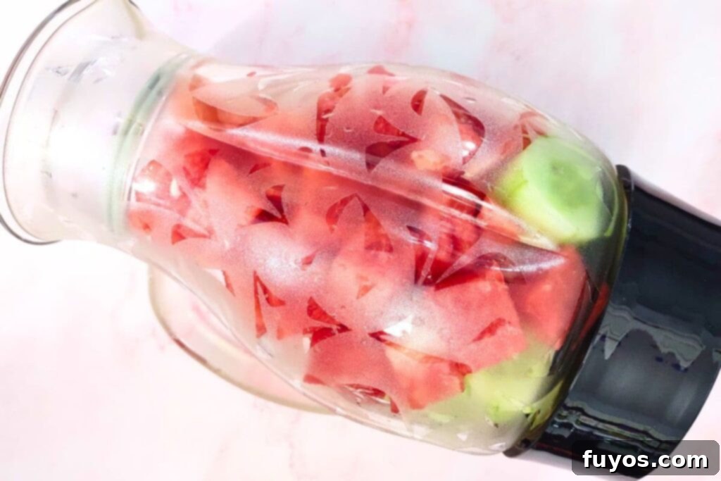 add watermelon, cucumber, and ingredients to blender
