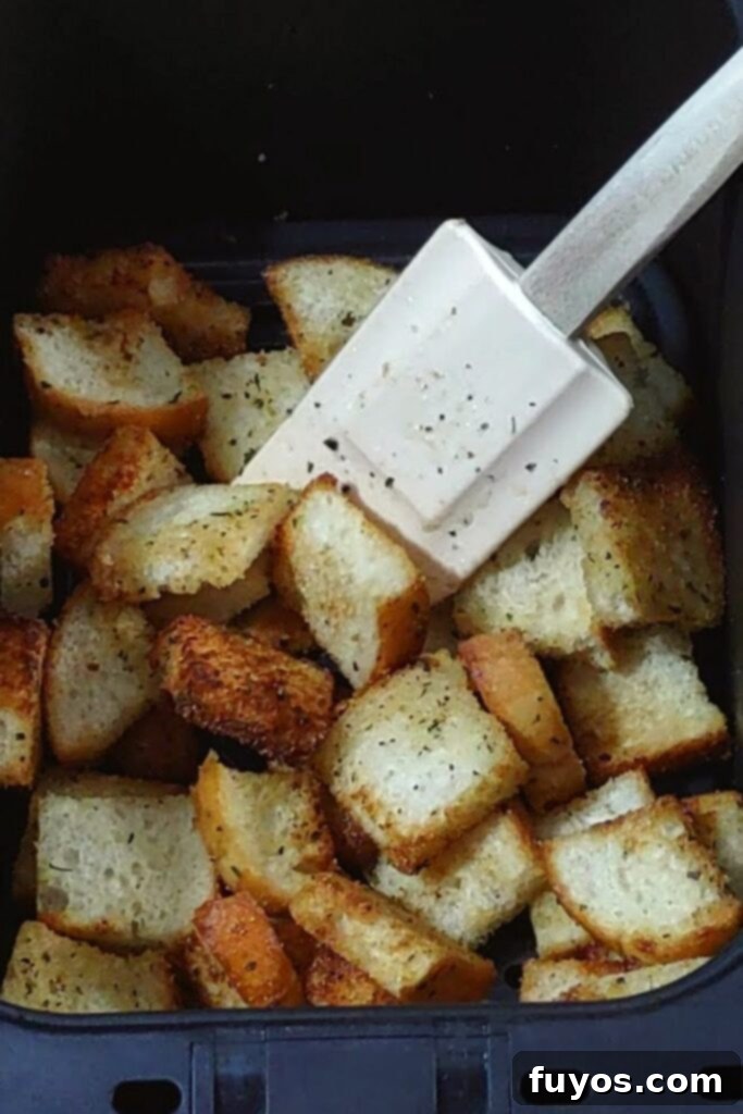 Crispy Herb Garlic Croutons Made in Your Air Fryer 7 toss partially cooked croutons in air fryer basket