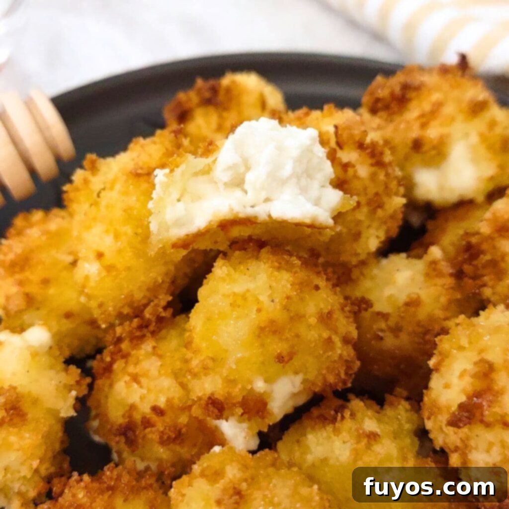 Air Fryer Goat Cheese Balls Crunchy Creamy Delight 2 Crispy air fryer goat cheese balls with a warm, gooey center, perfect for an appetizer.