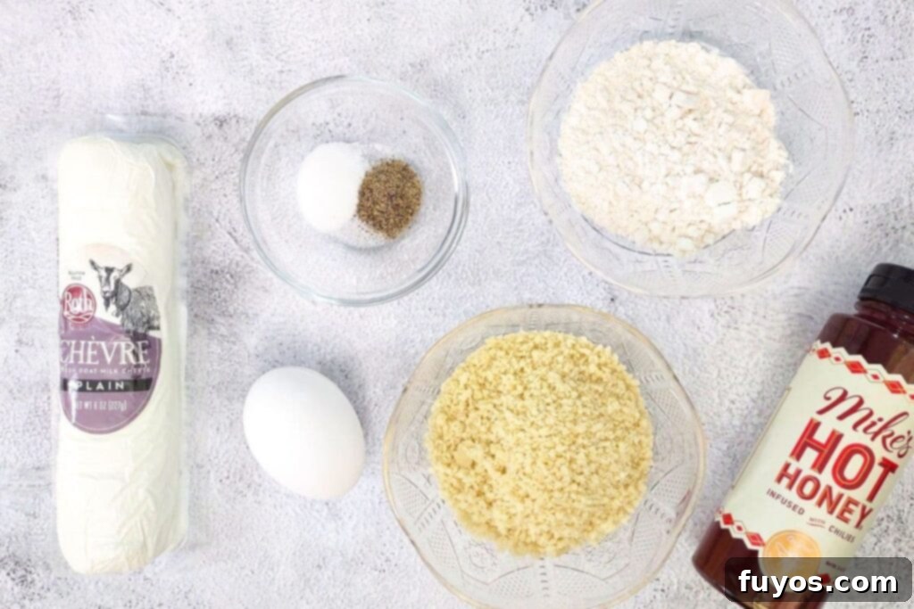 Air Fryer Goat Cheese Balls Crunchy Creamy Delight 4 A collection of ingredients laid out on a table to make air fryer goat cheese balls at home.