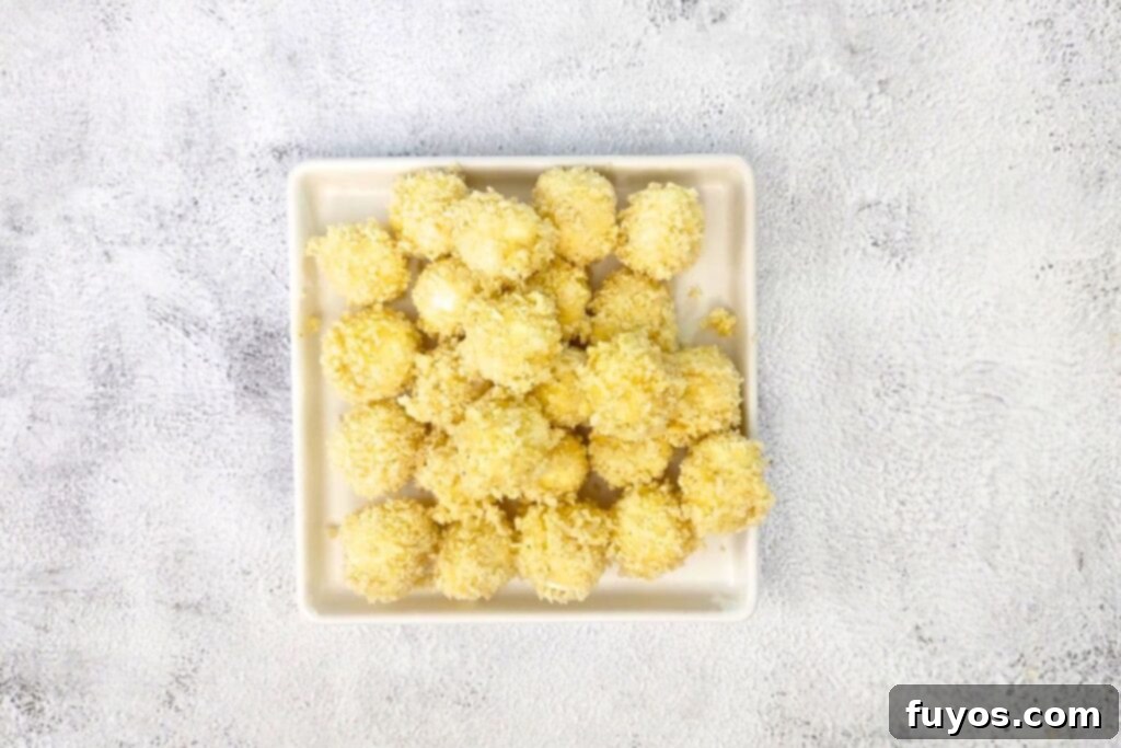 Air Fryer Goat Cheese Balls Crunchy Creamy Delight 9 Fully dredged and breaded goat cheese balls ready for the air fryer.