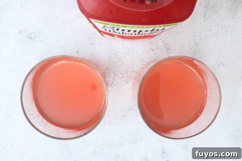 add gin and watermelon juice to rocks glass