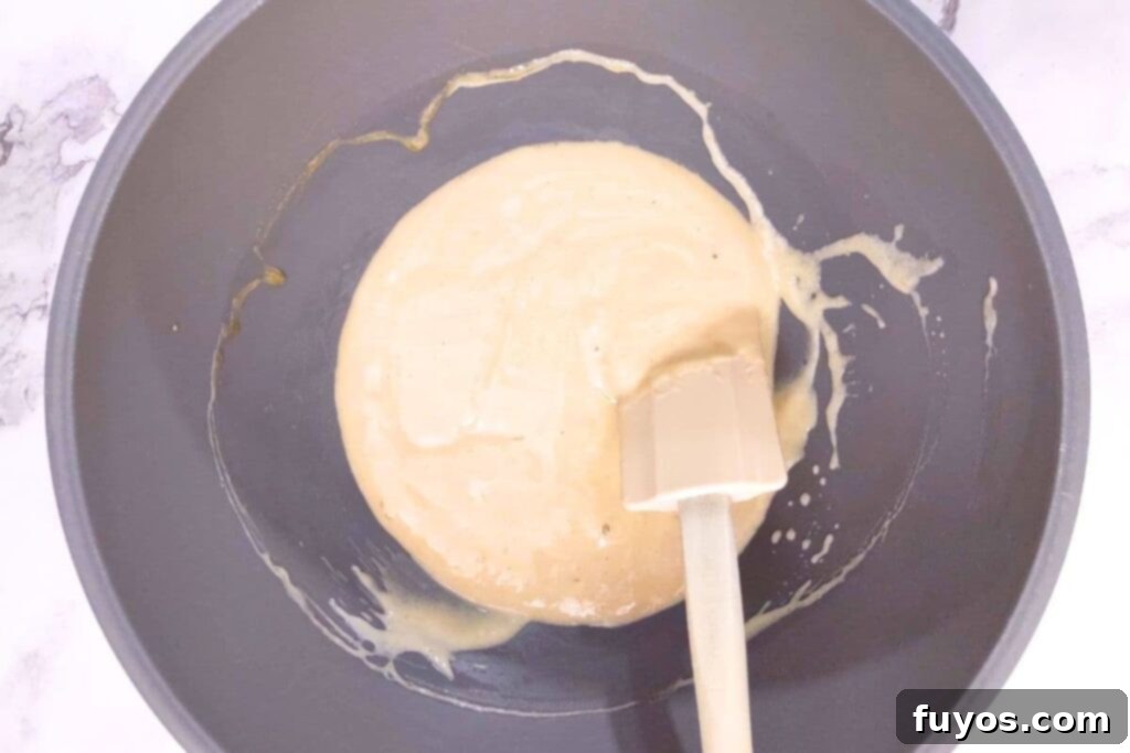 Air Fryer Blueberry Muffins Bite Into Bliss 5 combine sugar, egg, vanilla, oil, and sour cream in a mixing bowl