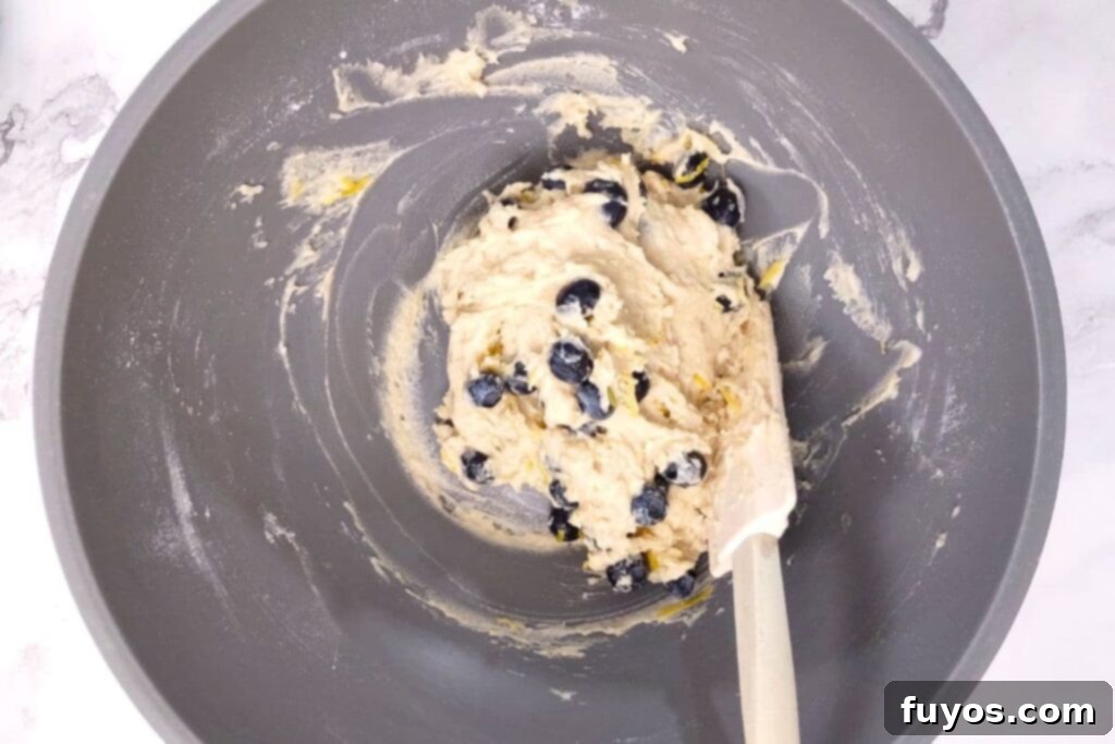 Air Fryer Blueberry Muffins Bite Into Bliss 7 fold blueberries into batter
