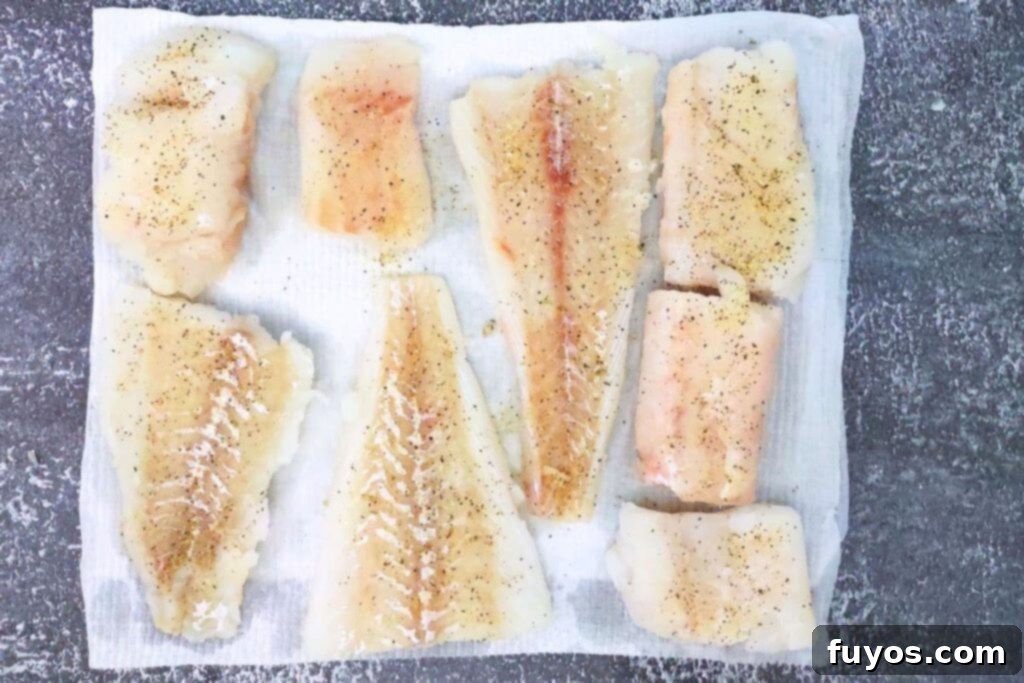 Air Fryer Crispy Parmesan Cod 6 add lemon pepper seasoning to cod fillets