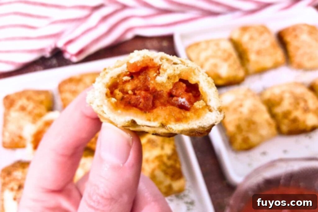 Air Fryer DiGiorno Pizza Bites The Secret to Golden Crispiness 3 A DiGiorno Pizza Bite cut in half, showcasing its cheesy filling and perfectly air-fried crust.