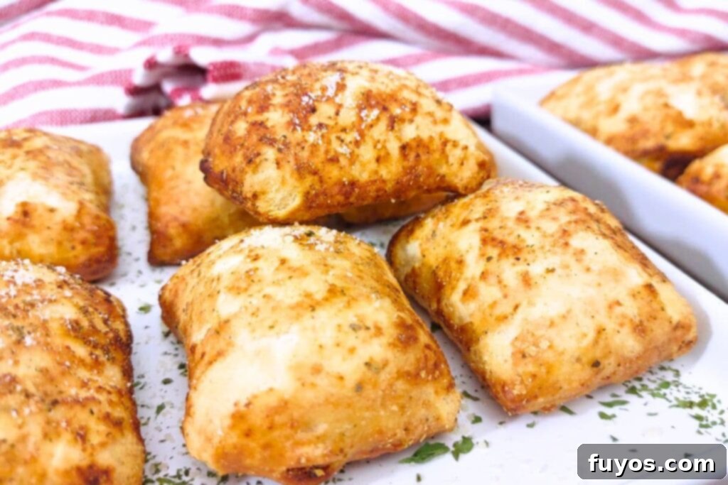 Air Fryer DiGiorno Pizza Bites The Secret to Golden Crispiness 7 A stack of warm and crispy DiGiorno Pizza Bites beautifully arranged on a white plate, ready to be enjoyed.