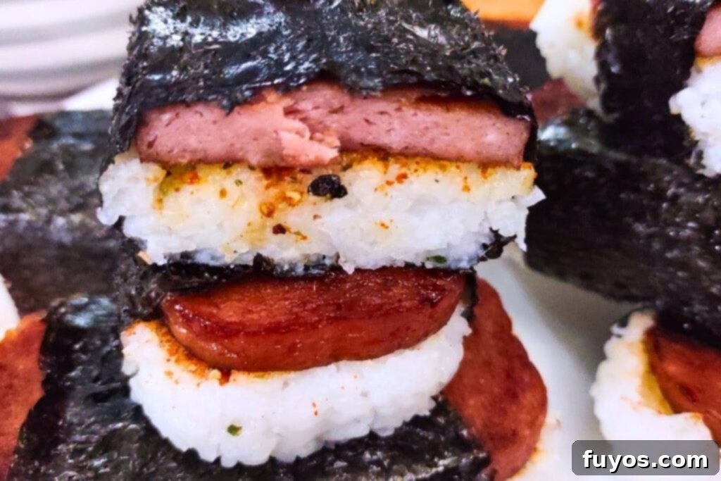Air Fryer Spam Musubi Your Homegrown Hawaiian Treat 11 cut in half roll of spam musubi stacked on top of each other