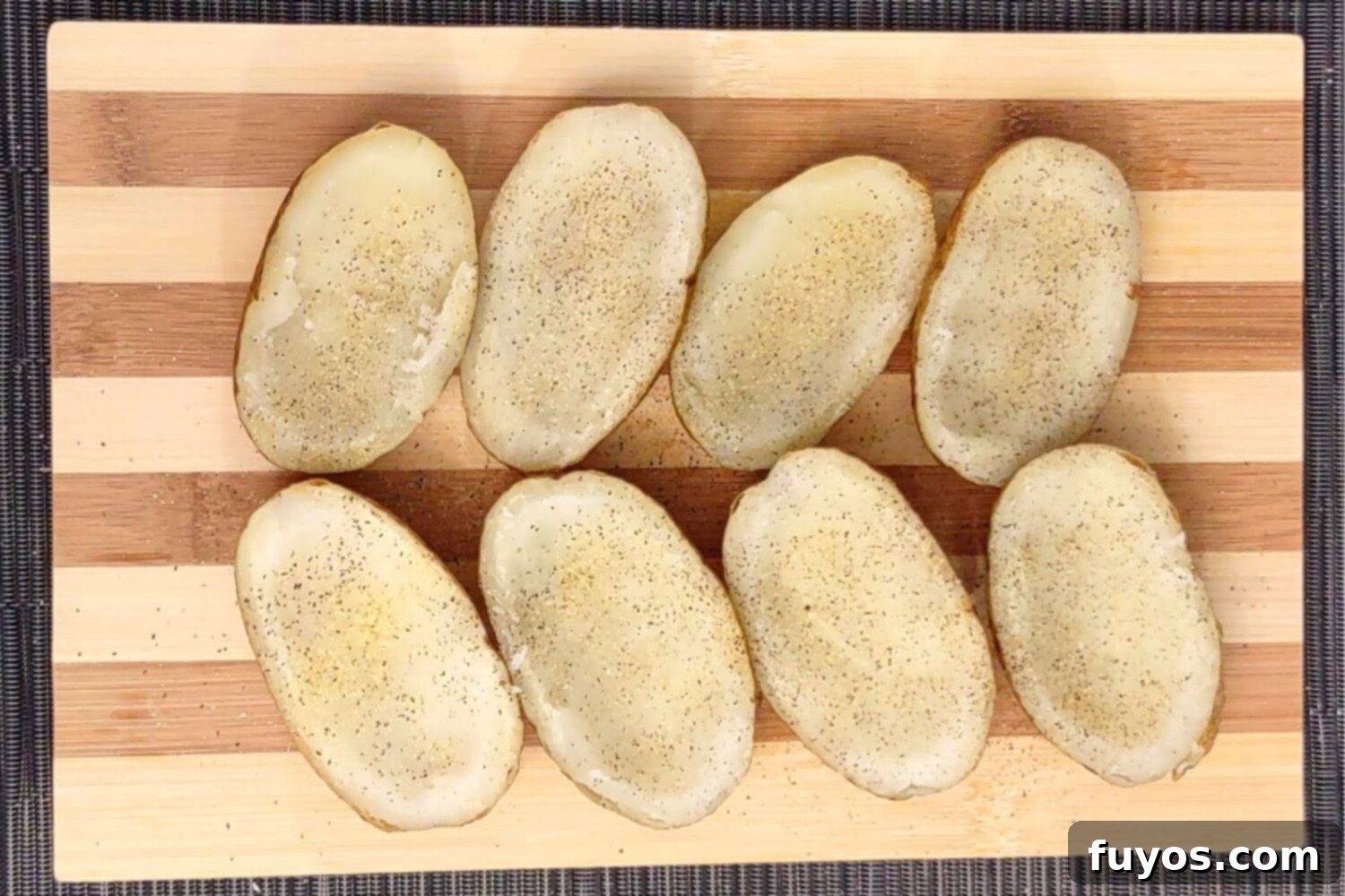 The Best Air Fryer Potato Skins 6 Seasoning potato skins with salt, pepper, and garlic powder