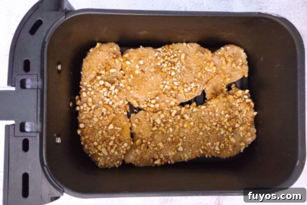 place pretzel crusted chicken cutlets in air fryer basket