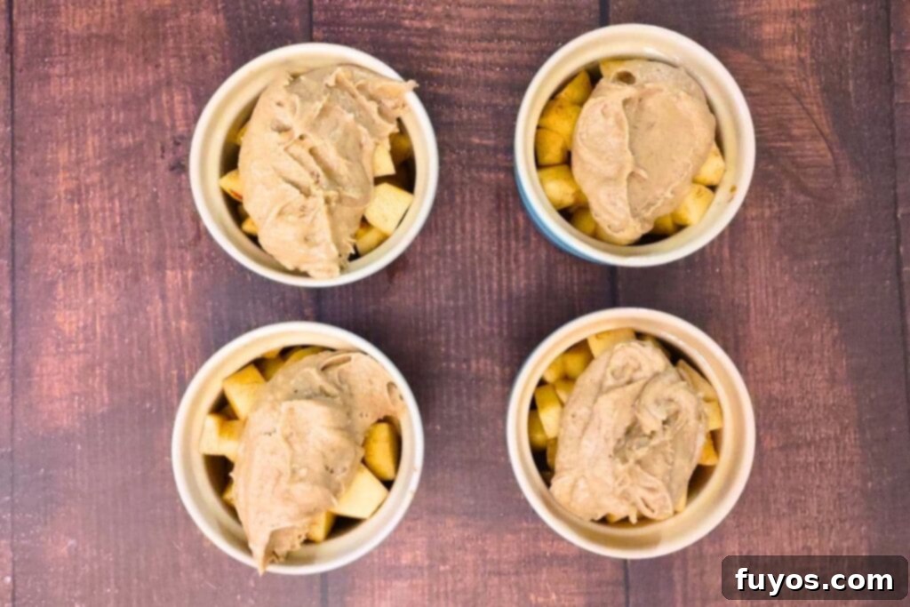 Easy Air Fryer Apple Cobbler Recipe Sweet Autumn Delight 8 top each apple filled ramekin with cobbler batter