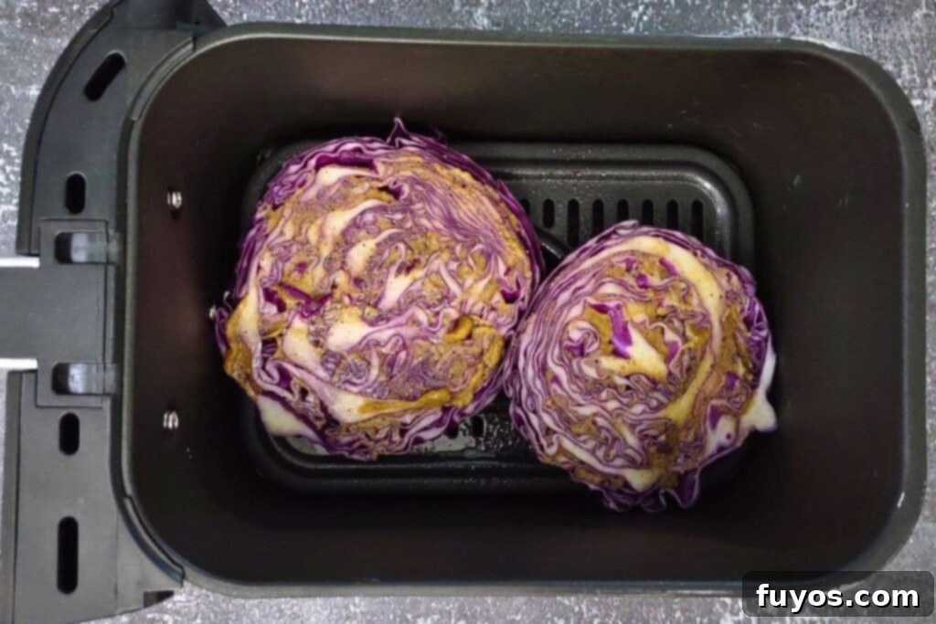 Vibrant Air Fryer Red Cabbage with a Perfect Crunch 7 place red cabbage slices in air fryer basket and brush the tops with the sauce