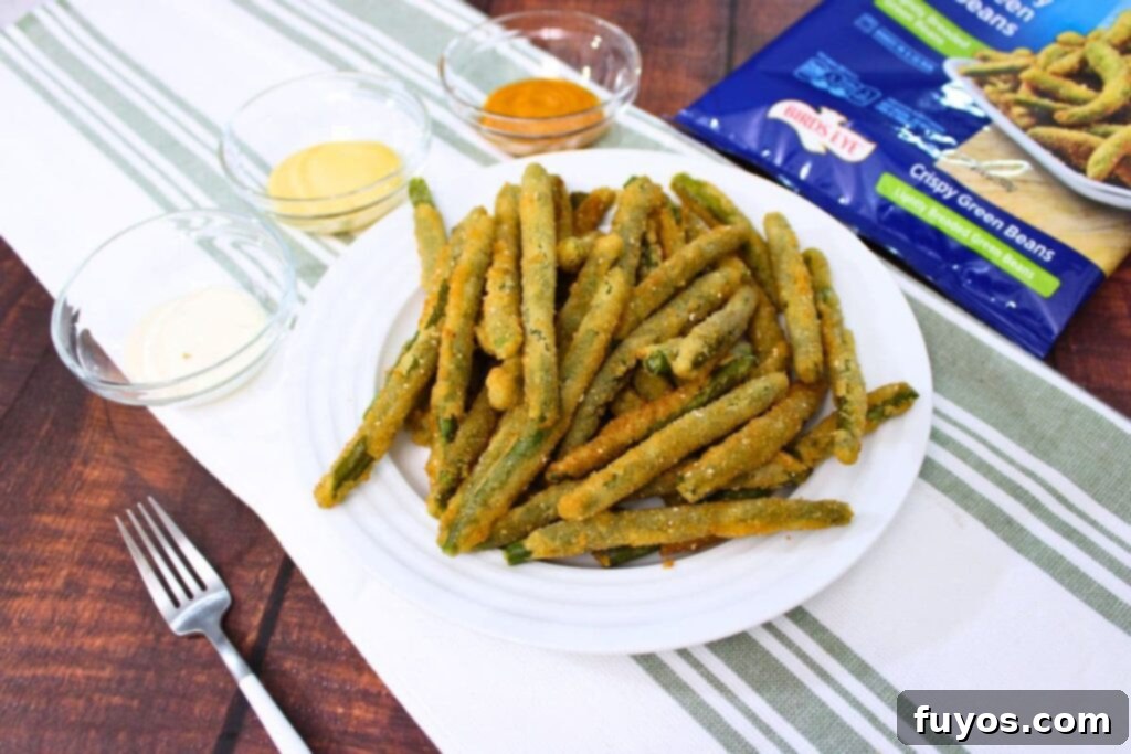 easy crispy birds eye green beans on a plate with dipping sauce