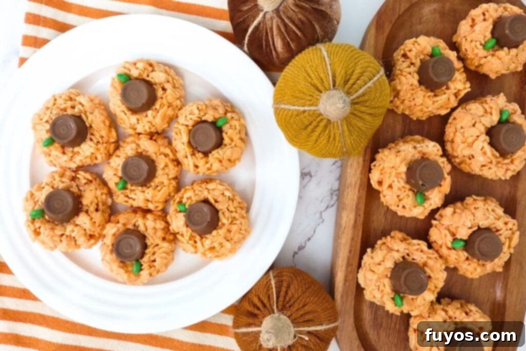 overhead view of halloween pumpkin rice krispie treats stacked on a plate