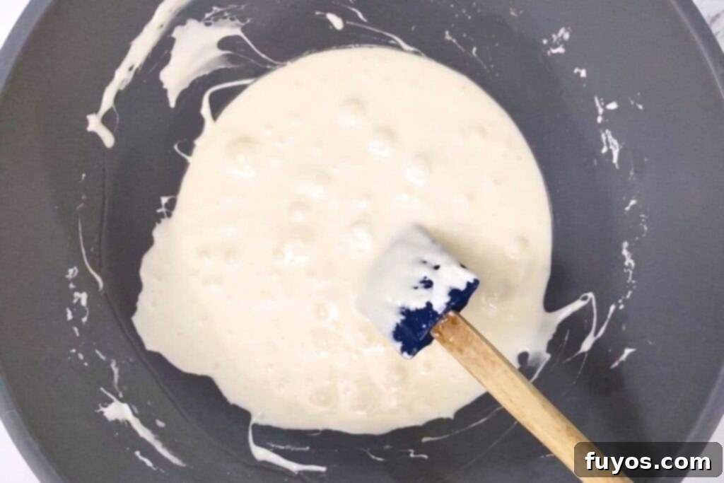 add mini marshmallows to butter, stir, and microwave to melt