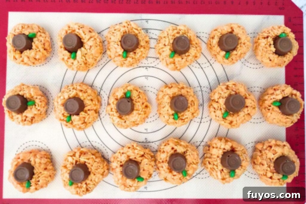 place a rolo candy on top of each rice krispie ball