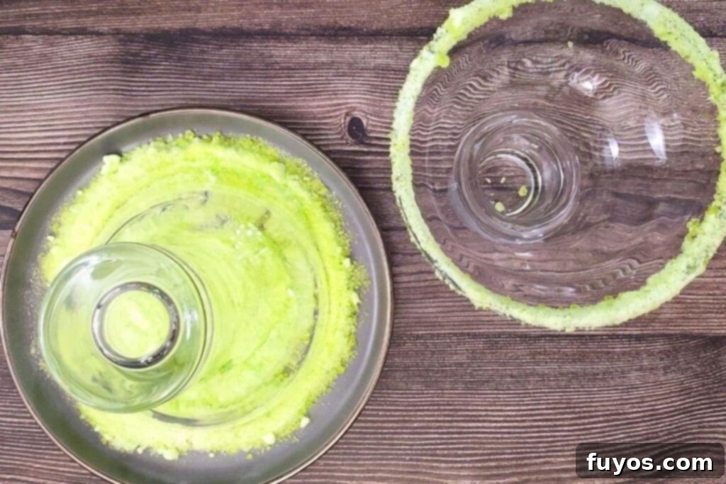 Sweet and Tart Green Apple Margarita Bliss 5 rub glass rims in the crushed jolly ranchers