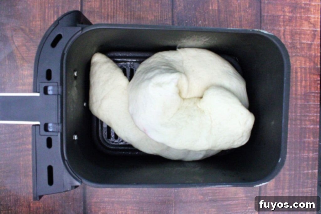 Air Fryer Serpent Bites: Your Halloween Party Hit 12 curl calzone dough to form a snake in the air fryer basket