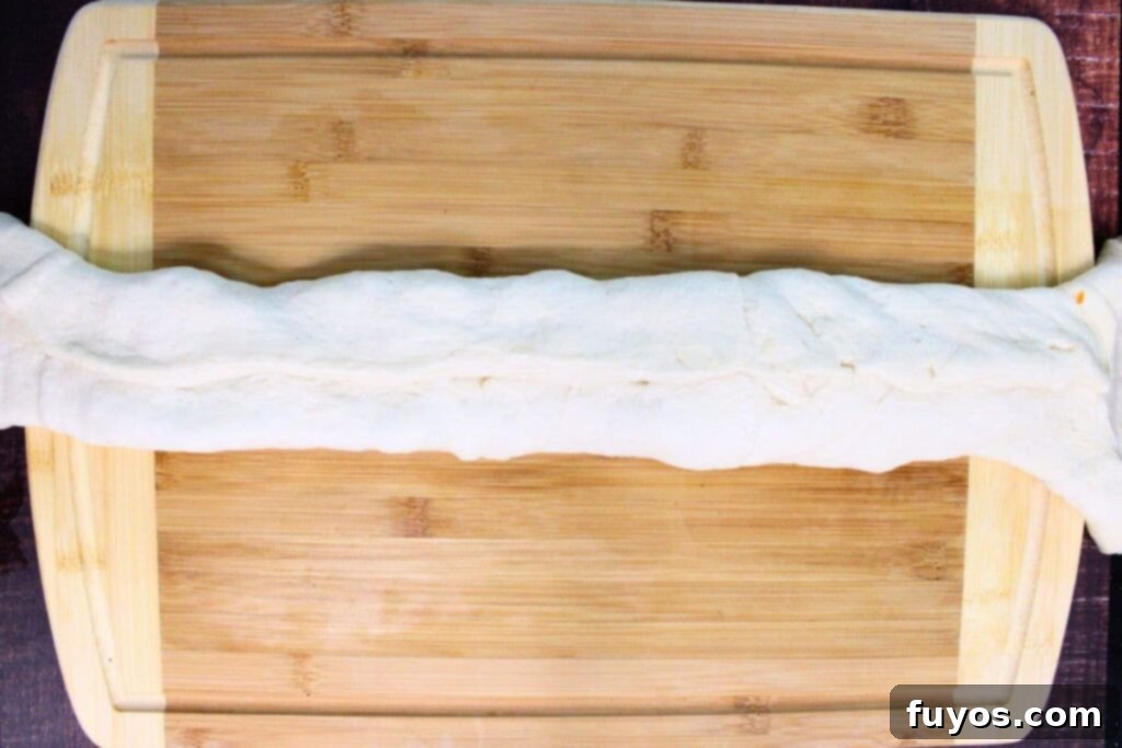 Air Fryer Serpent Bites: Your Halloween Party Hit 9 roll the sides of the dough pinching the seams to form a tube