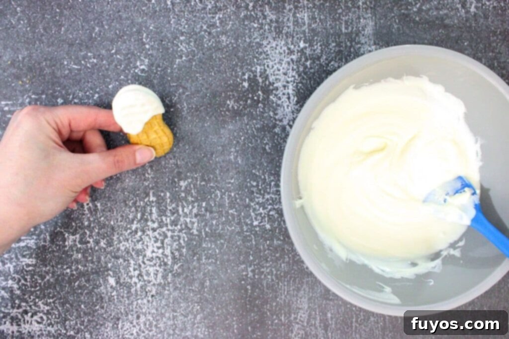 Haunted Nutter Butter Ghosts 3 Ingredient Halloween Magic 8 gently tap the nutter butter to allow the melted chocolate to naturally drip down the cookie