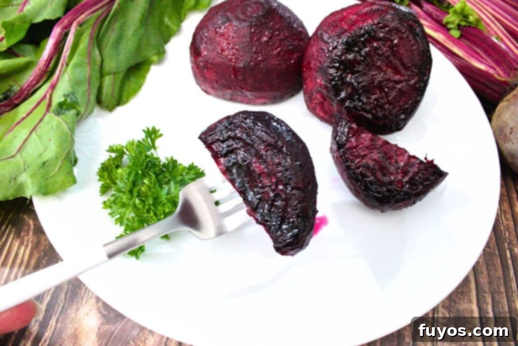 Air Fryer Roasted Whole Beets in Foil 3 sticking a fork through an air fryer whole roasted beet