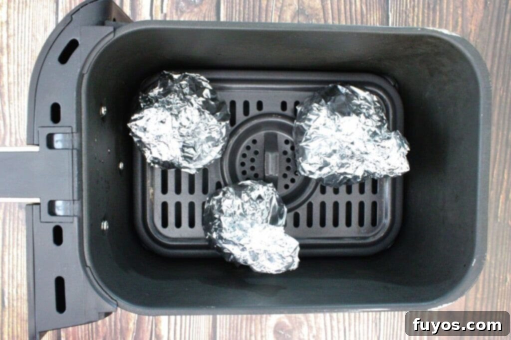 Air Fryer Roasted Whole Beets in Foil 7 place foil wrapped beets in air fryer basket