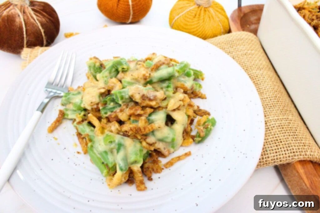 Easy air fryer green bean casserole served on a plate with a fork