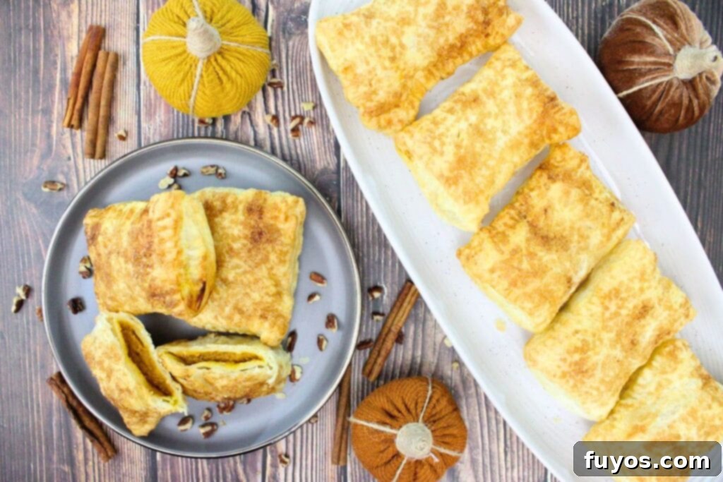 Autumn Air Fryer Pumpkin Puff Pastry Hand Pies 12 overhead view of air fryer puff pastry pumpkin hand pies on a plate and serving platter