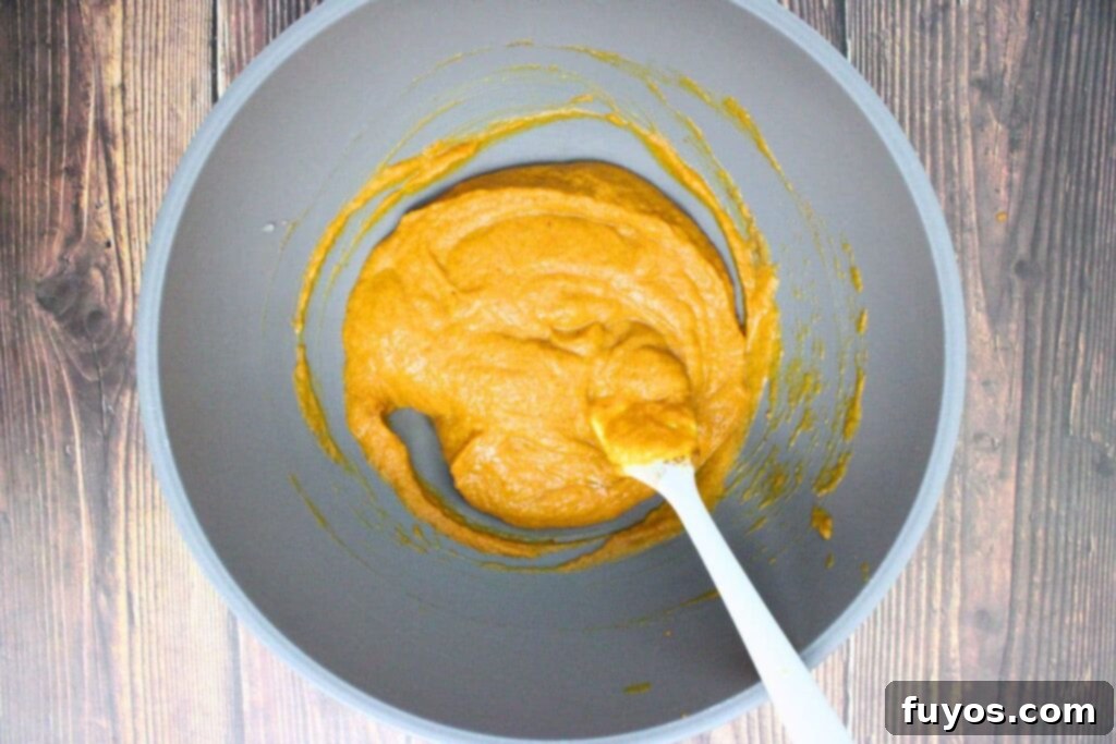 Autumn Air Fryer Pumpkin Puff Pastry Hand Pies 5 in a mixing bowl combine pumpkin puree, egg, brown sugar, heavy cream, pumpkin pie spice, and salt