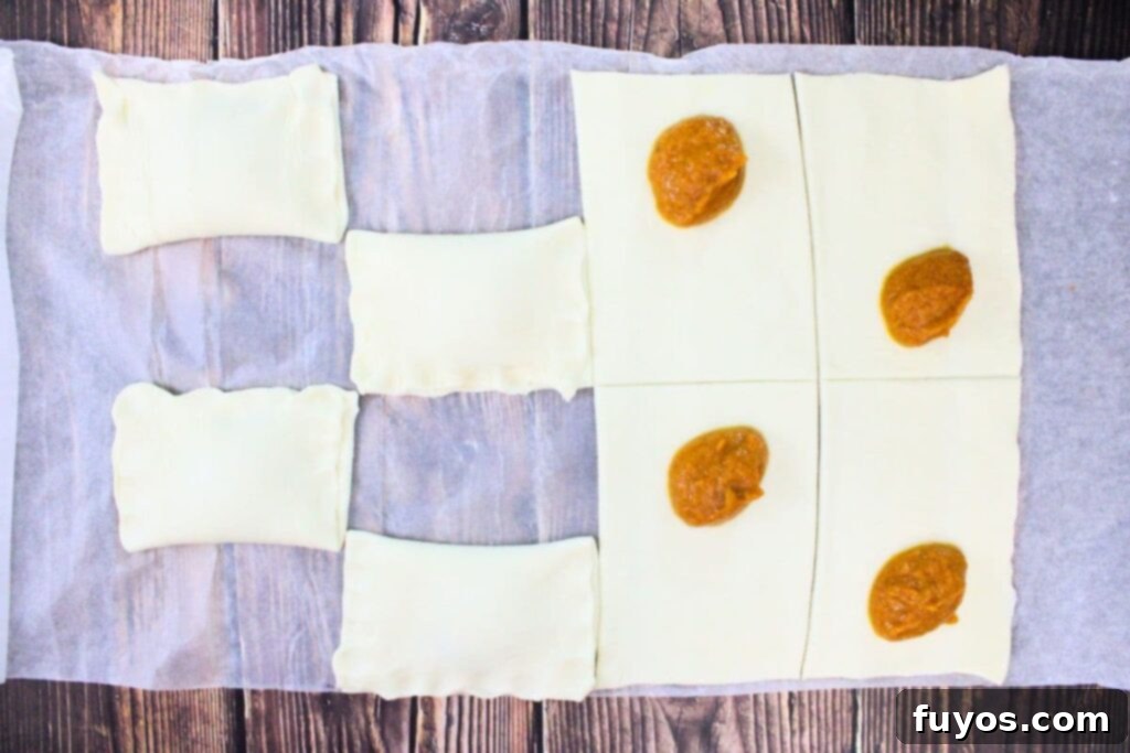 Autumn Air Fryer Pumpkin Puff Pastry Hand Pies 7 spoon a teaspoon of your pumpkin filling in the puff pastry squares