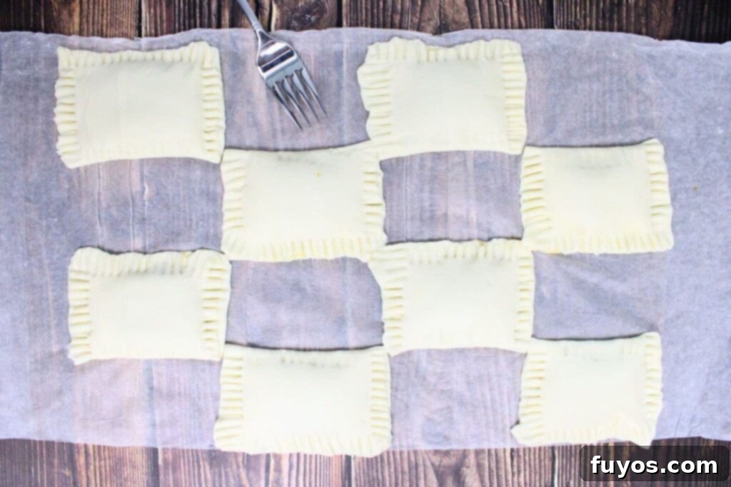 Autumn Air Fryer Pumpkin Puff Pastry Hand Pies 8 seal the filling in the puff pastry by crimping with a fork